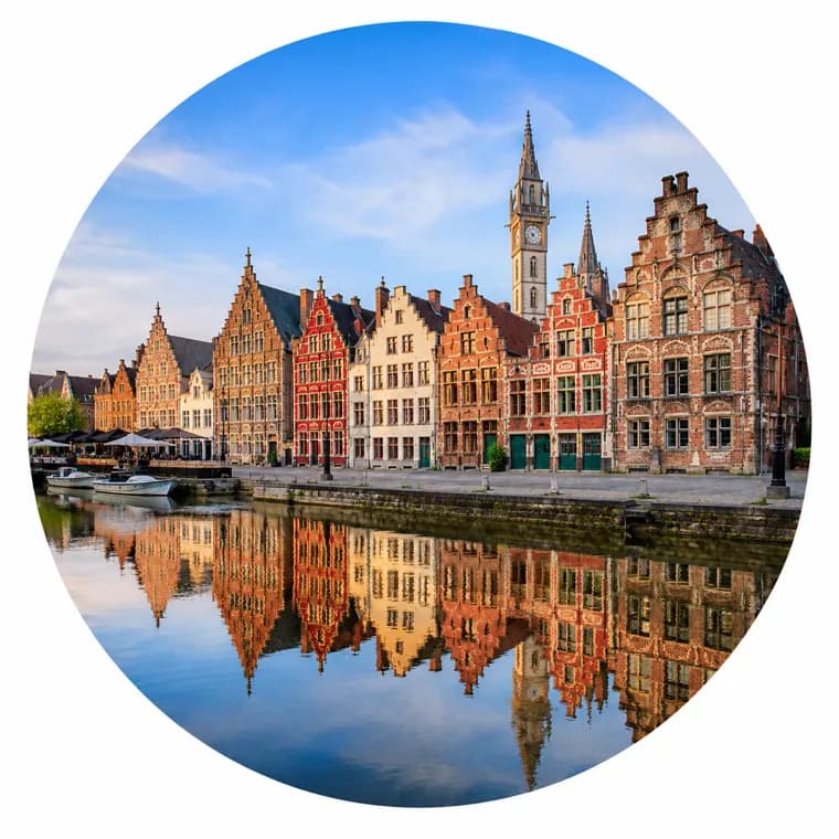 The Graslei waterfront in Ghent, Belgium, with historic stepped-gable guild houses reflected in the canal - Globexs expat housing in Ghent